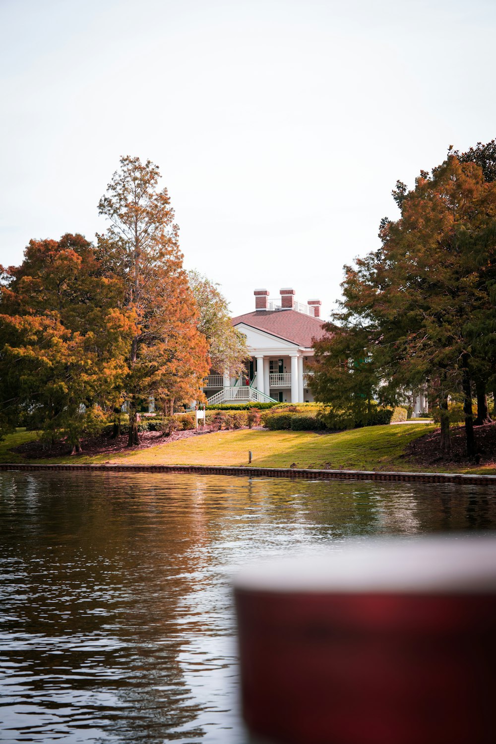 a house on the shore of a lake