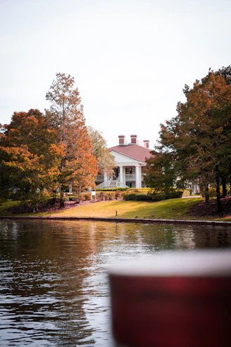 a house on the shore of a lake