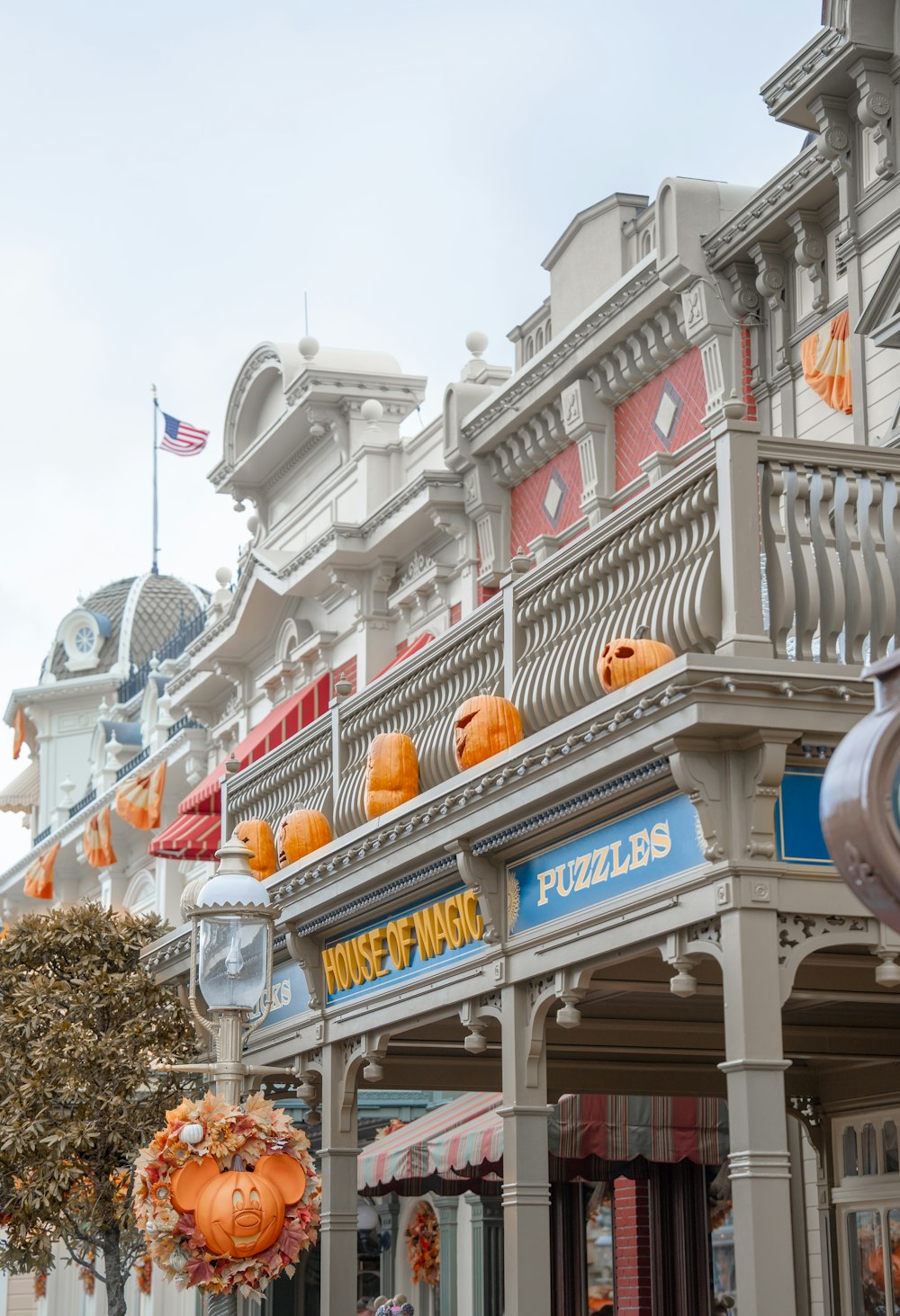 a row of buildings with pumpkin decorations on the balconies