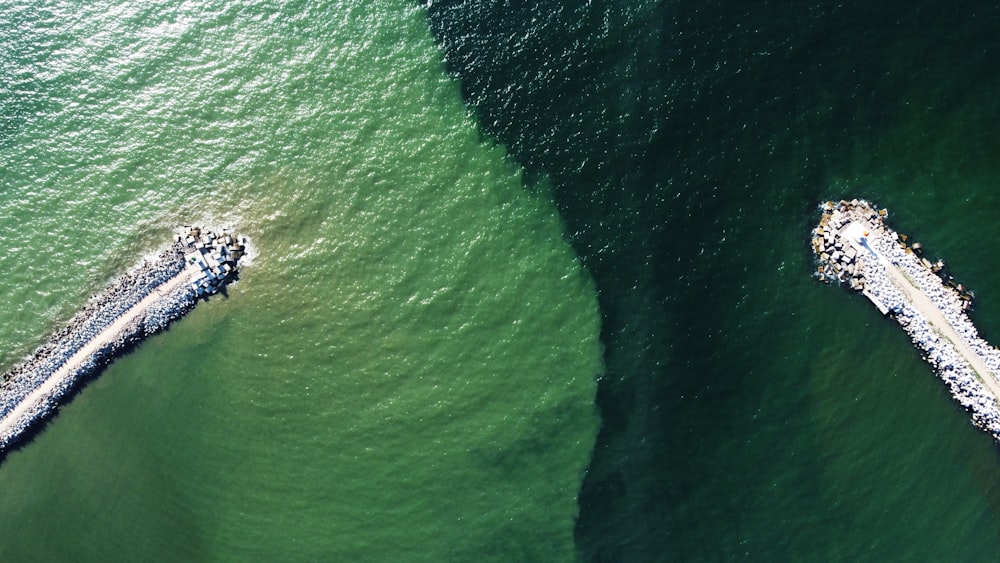 an aerial view of two boats in the water