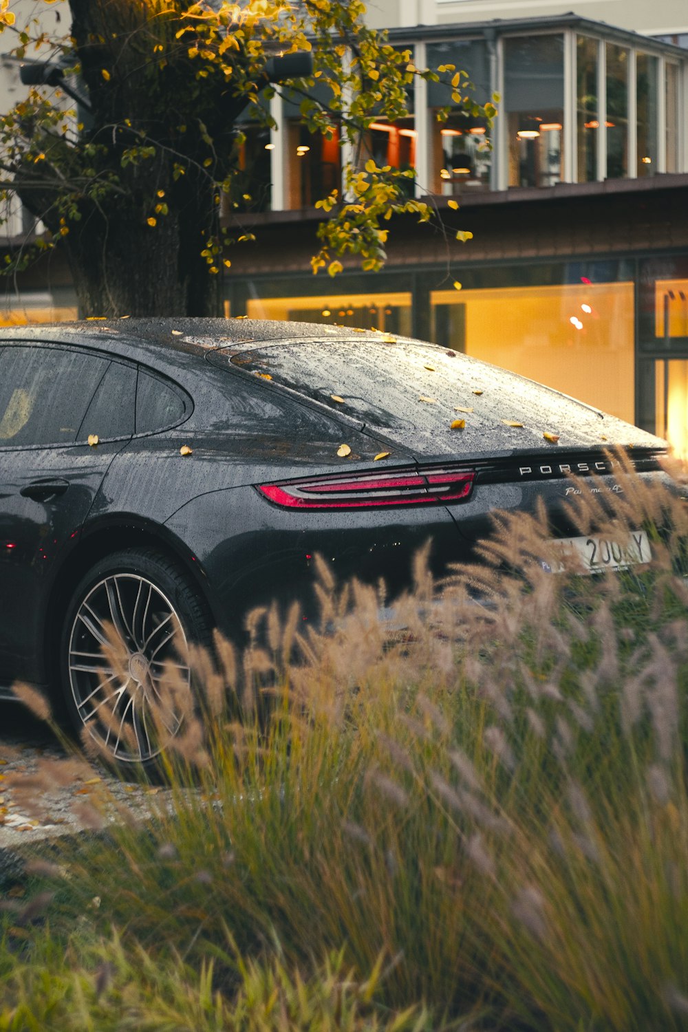 a black sports car parked in front of a building