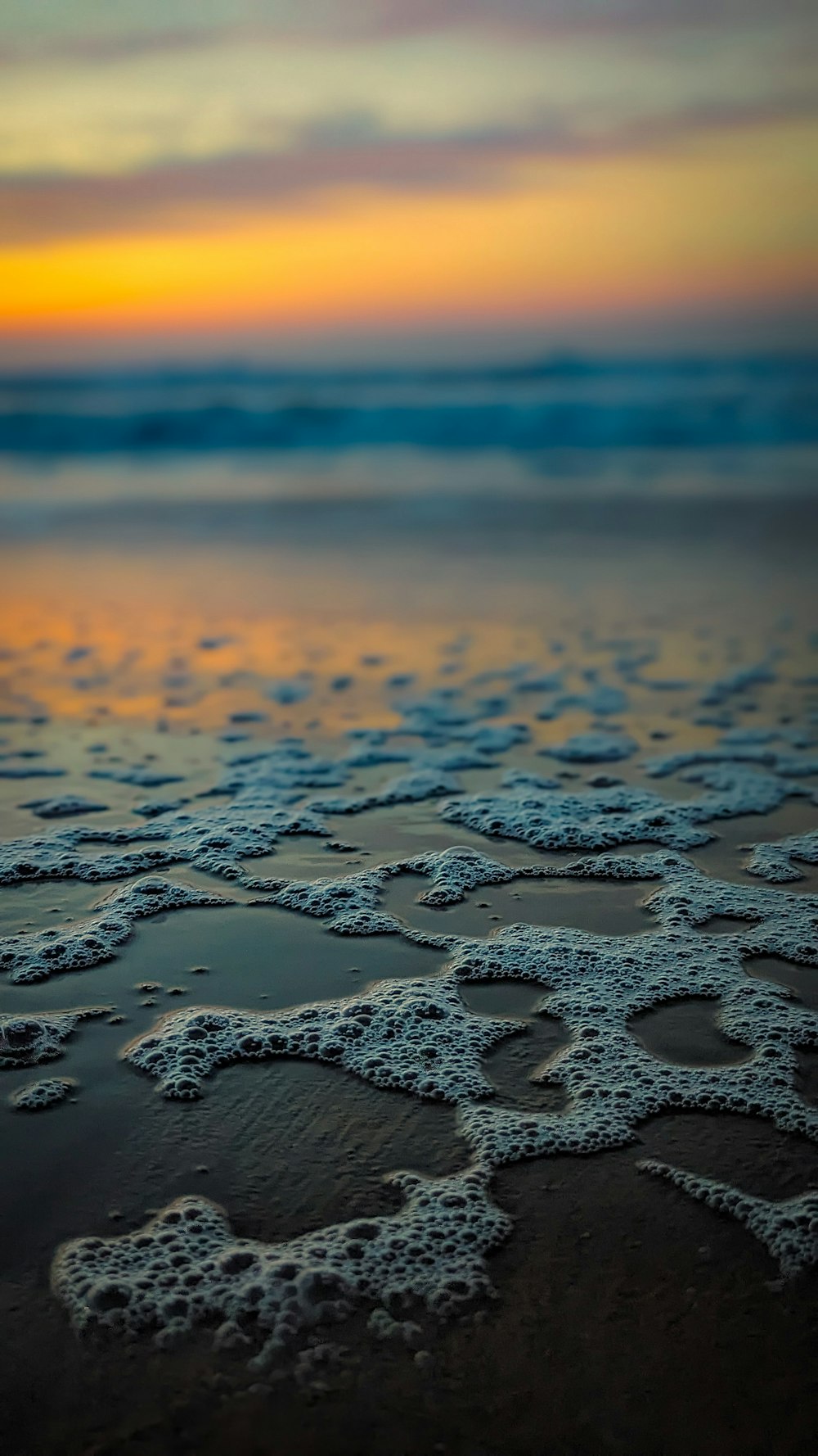 a close up of water on a beach