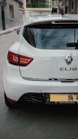 a white car parked on the side of the road