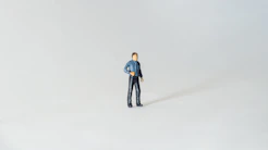 a figurine of a man standing in the snow