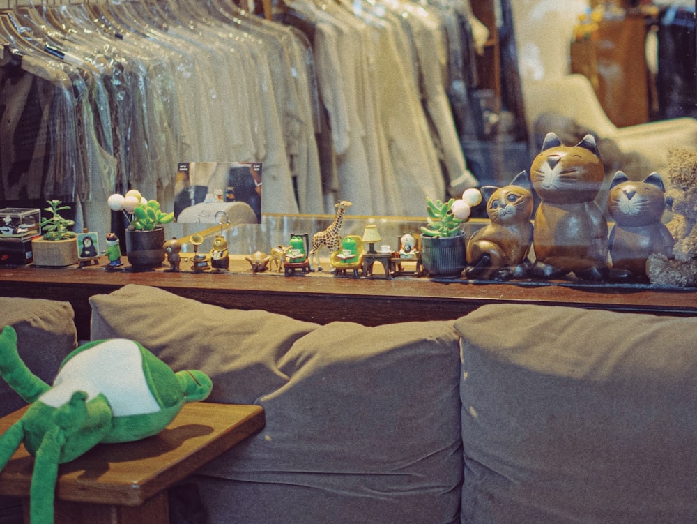 a living room filled with lots of furniture and stuffed animals