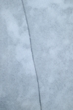 Image of a foundation crack with a measuring scale for size reference.