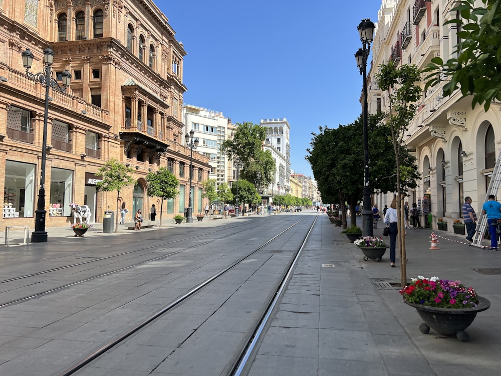 a city street with a train track running through it