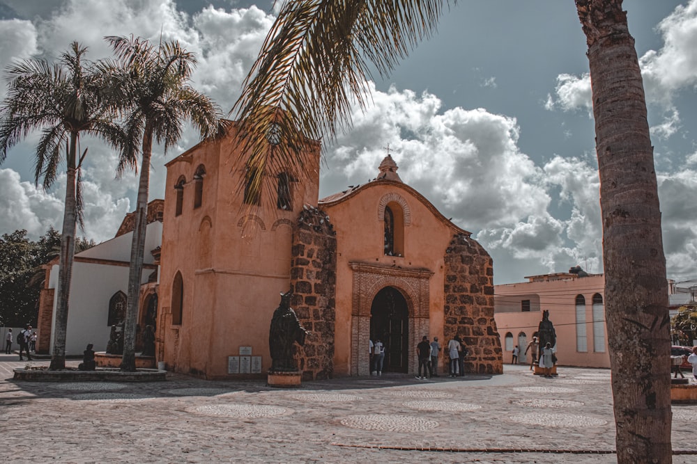 a church with a palm tree in front of it