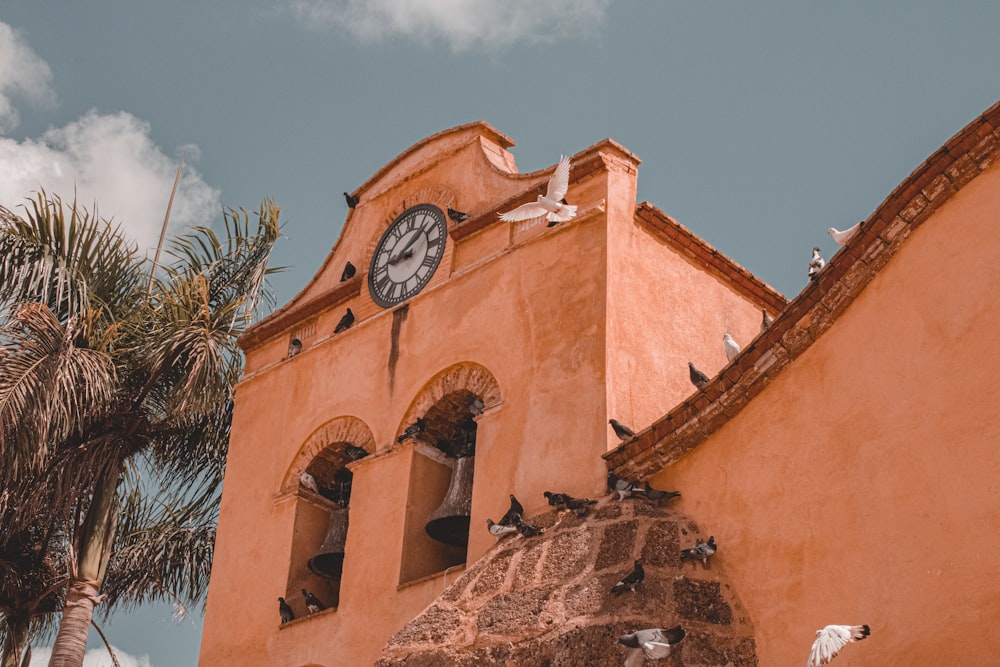 a building with a clock on the side of it