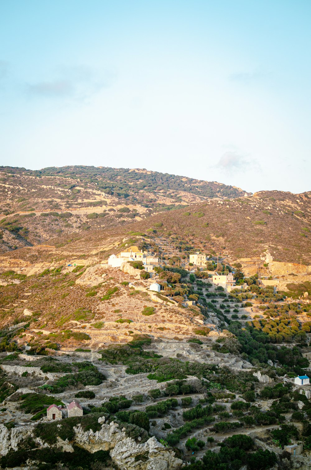 a hill with a small village on top of it