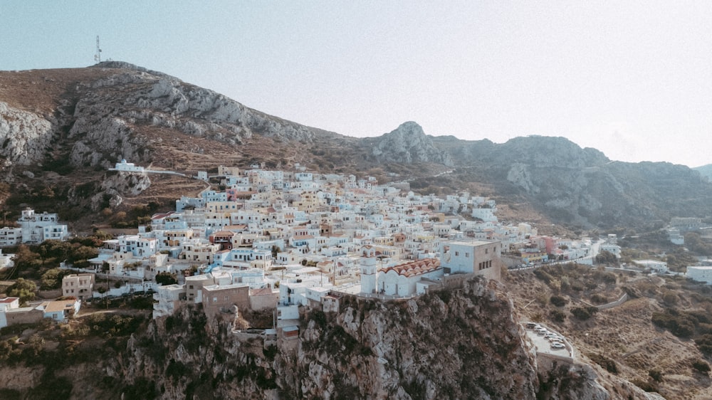 an aerial view of a village on a mountain