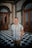 a man standing in front of a checkered floor