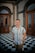 a man standing in front of a checkered floor