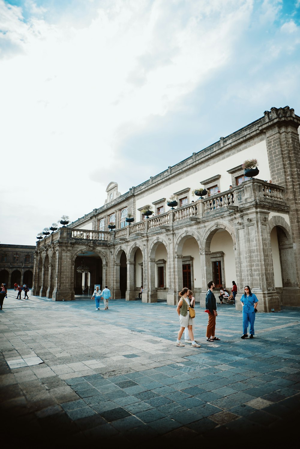 a group of people standing in front of a building