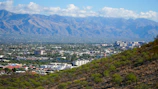 Scenic landscape of Valledupar with mountains and traditional vallenato music instruments in the foreground