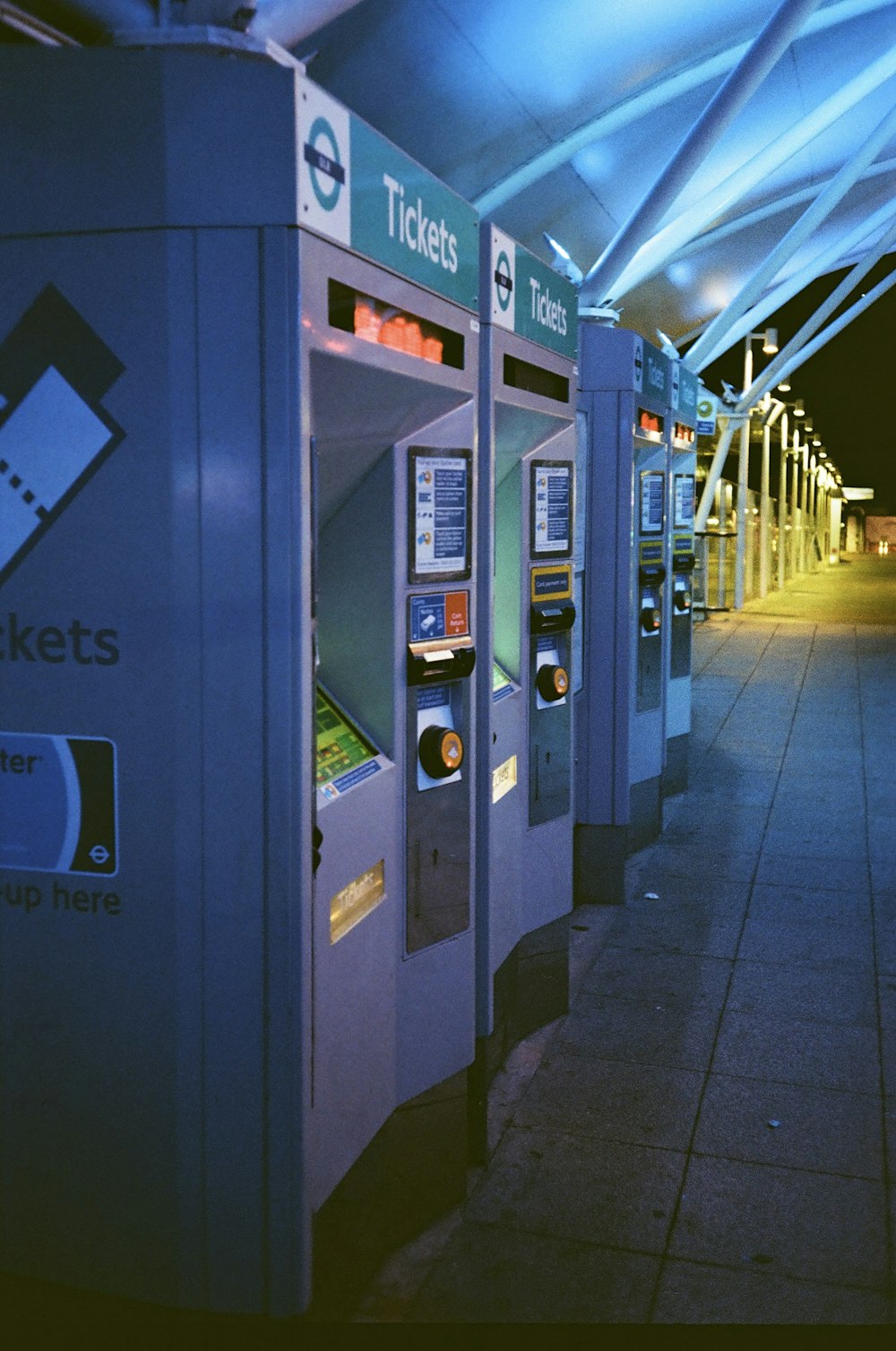a row of ticket machines sitting next to each other