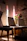 A warm, inviting therapy room with soft lighting and comfortable chairs arranged for a supportive conversation.