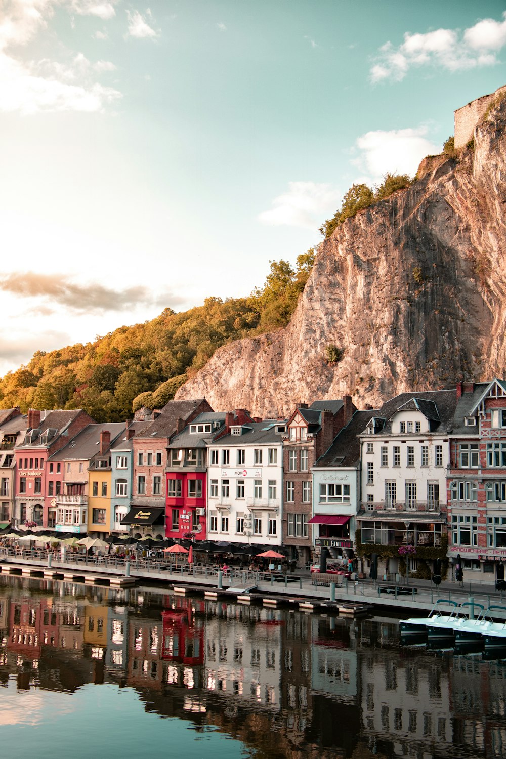 a group of buildings next to a body of water