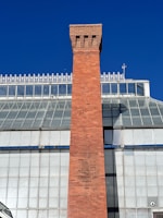 a tall brick tower with a clock on top of it
