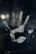 A blurred handprint, possibly on glass or a reflective surface, with smudges and fingerprints visible. The background is dark, enhancing the visibility of the handprint.