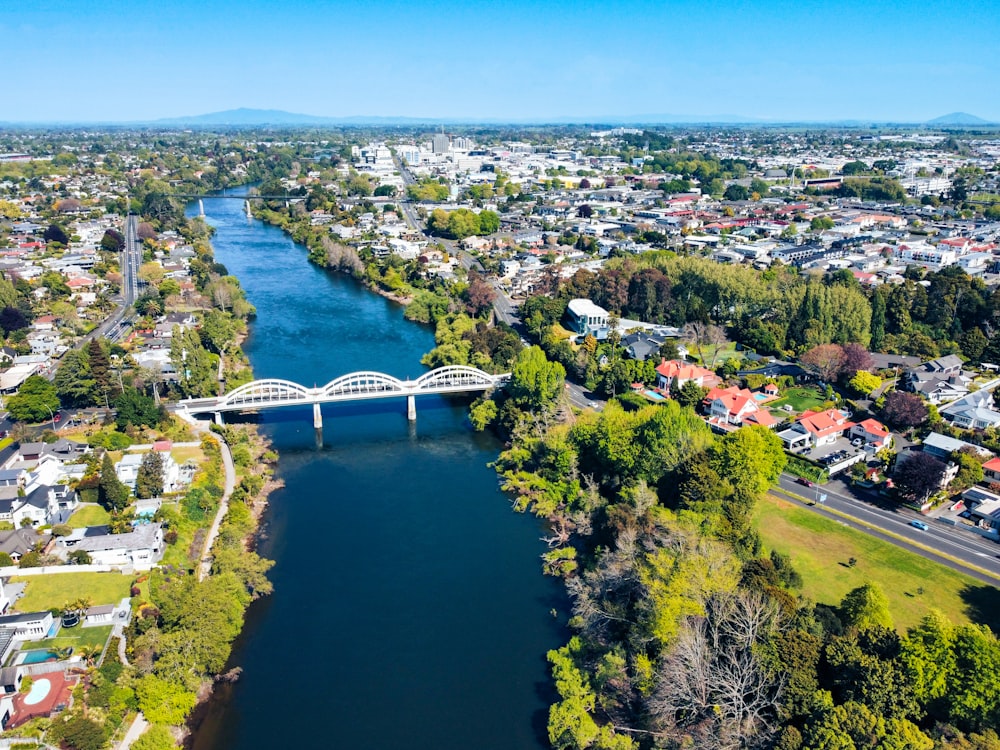 an aerial view of a river running through a city