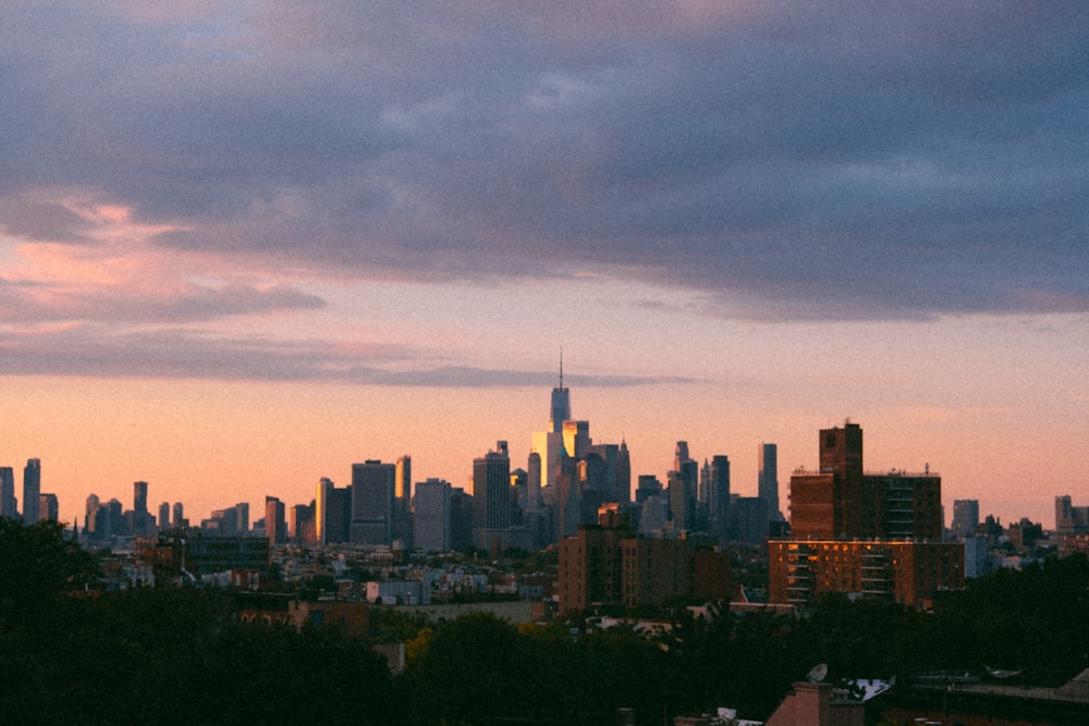 a view of a city skyline at sunset