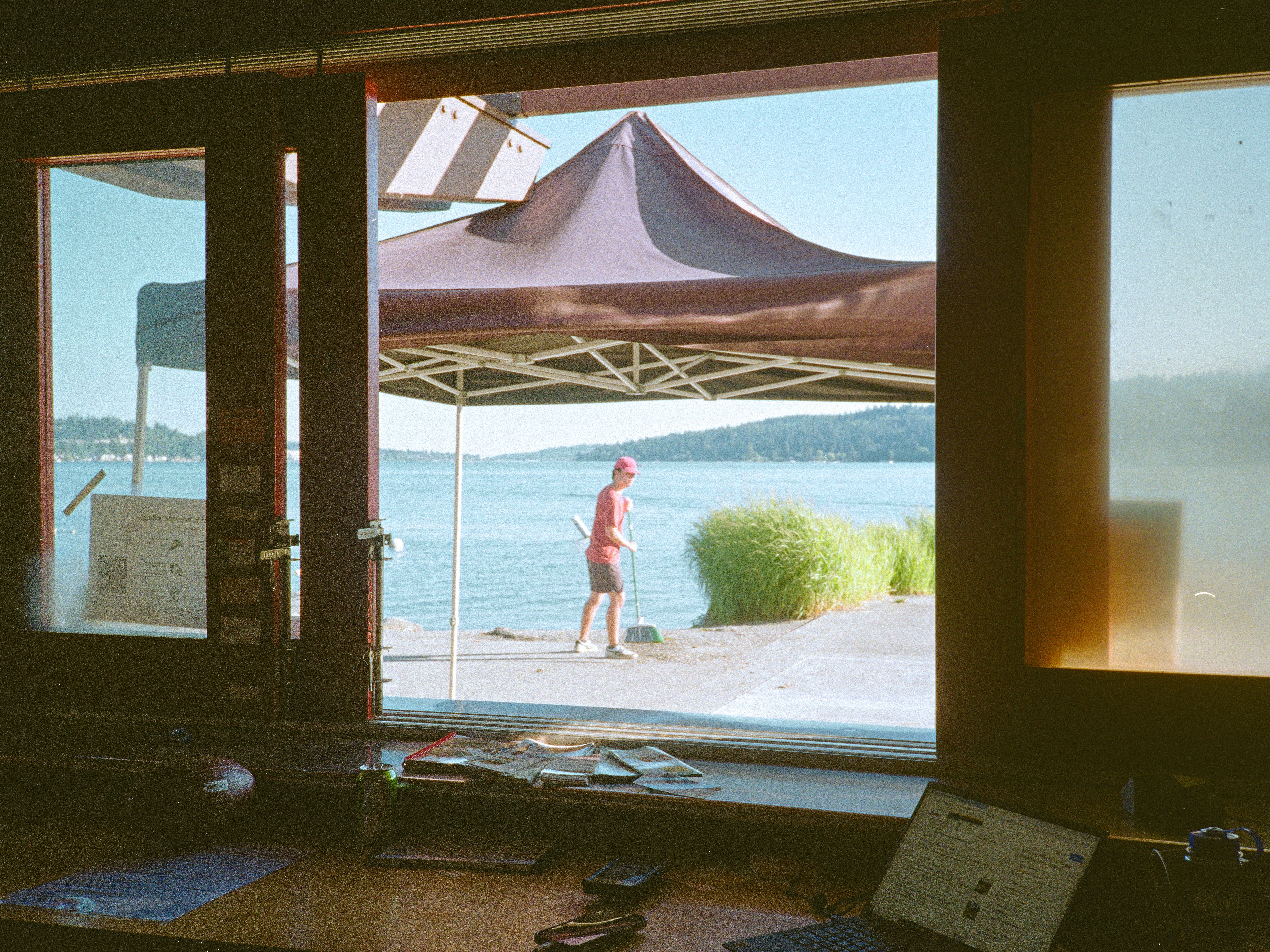 professional installing window film in a commercial space