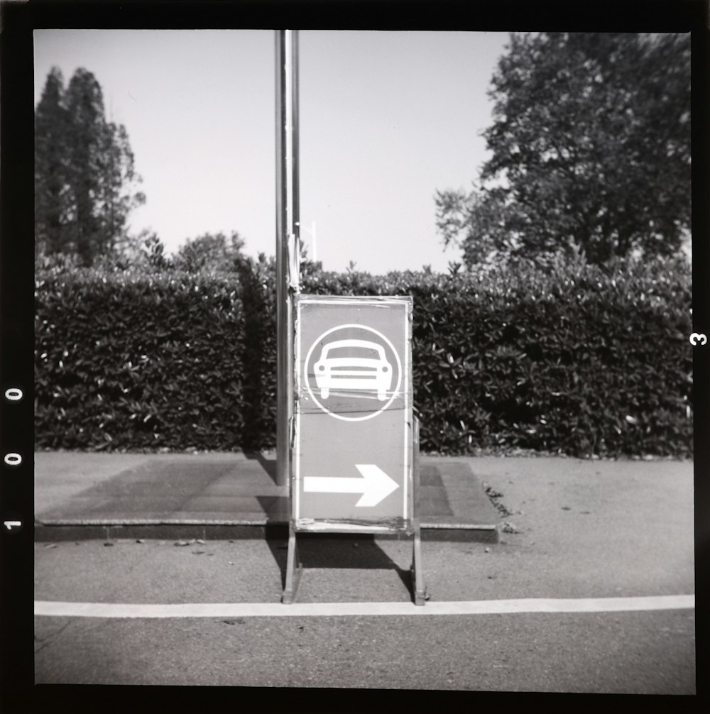 a black and white photo of a street sign