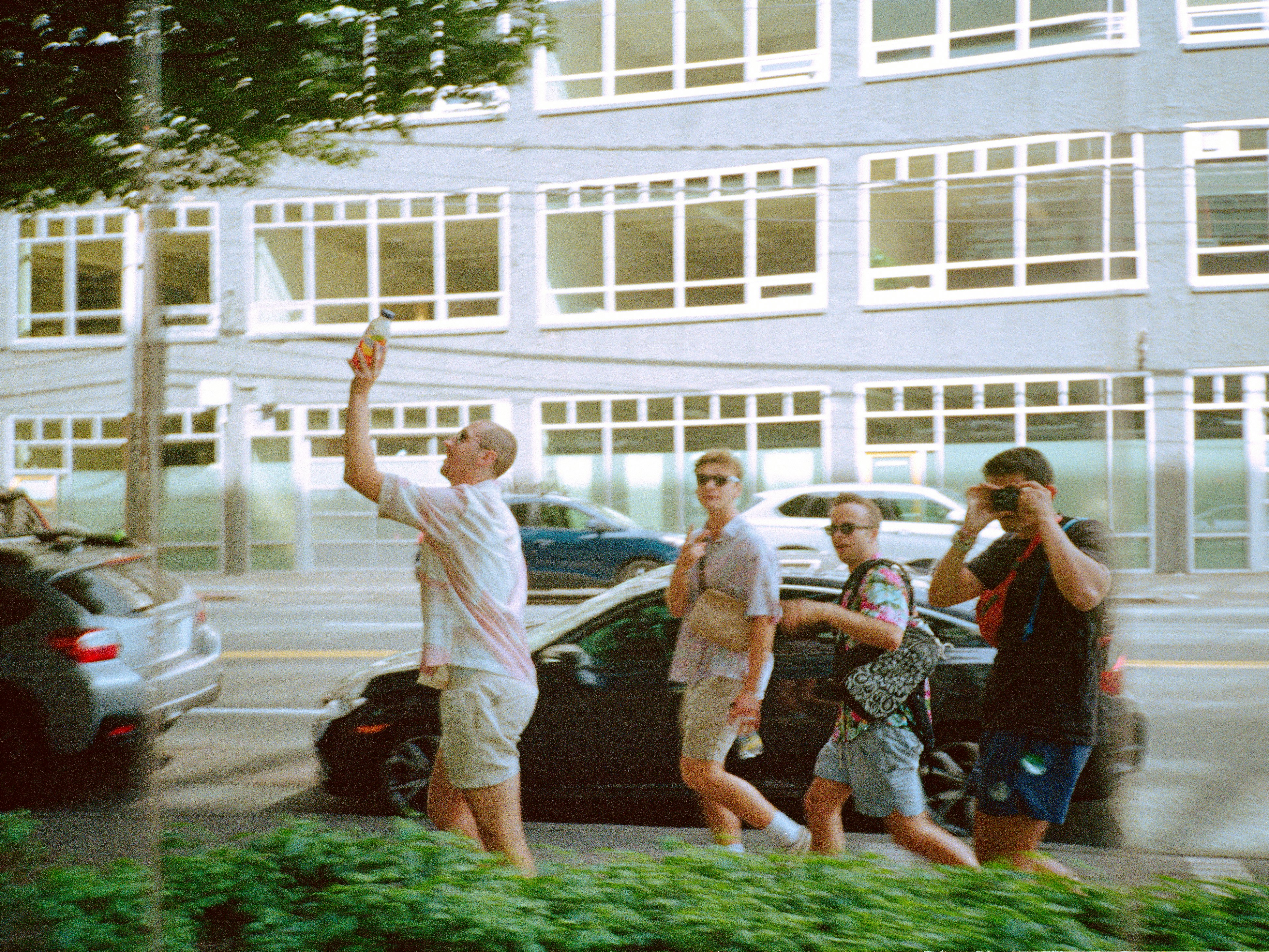 a group of people walking down a street