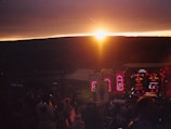 A short film still showing a group enjoying a sunset concert with 'le jour d'après' watermark.