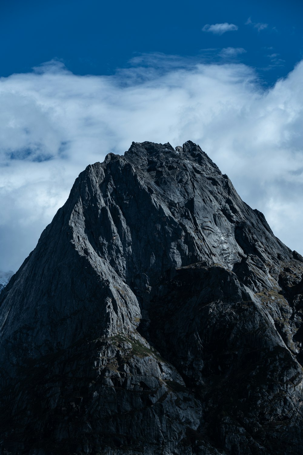 a very tall mountain with a sky background