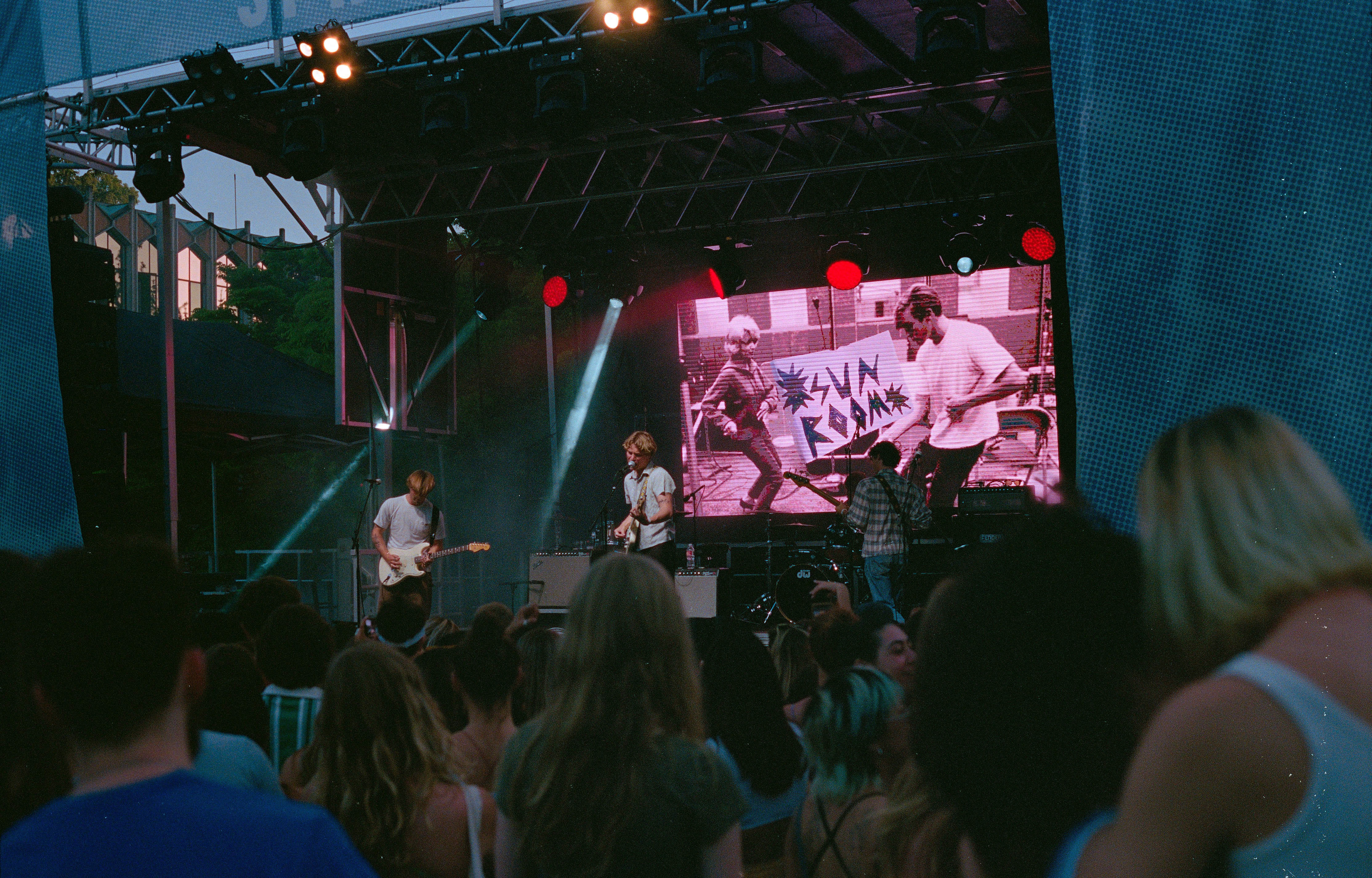 a group of people standing on top of a stage