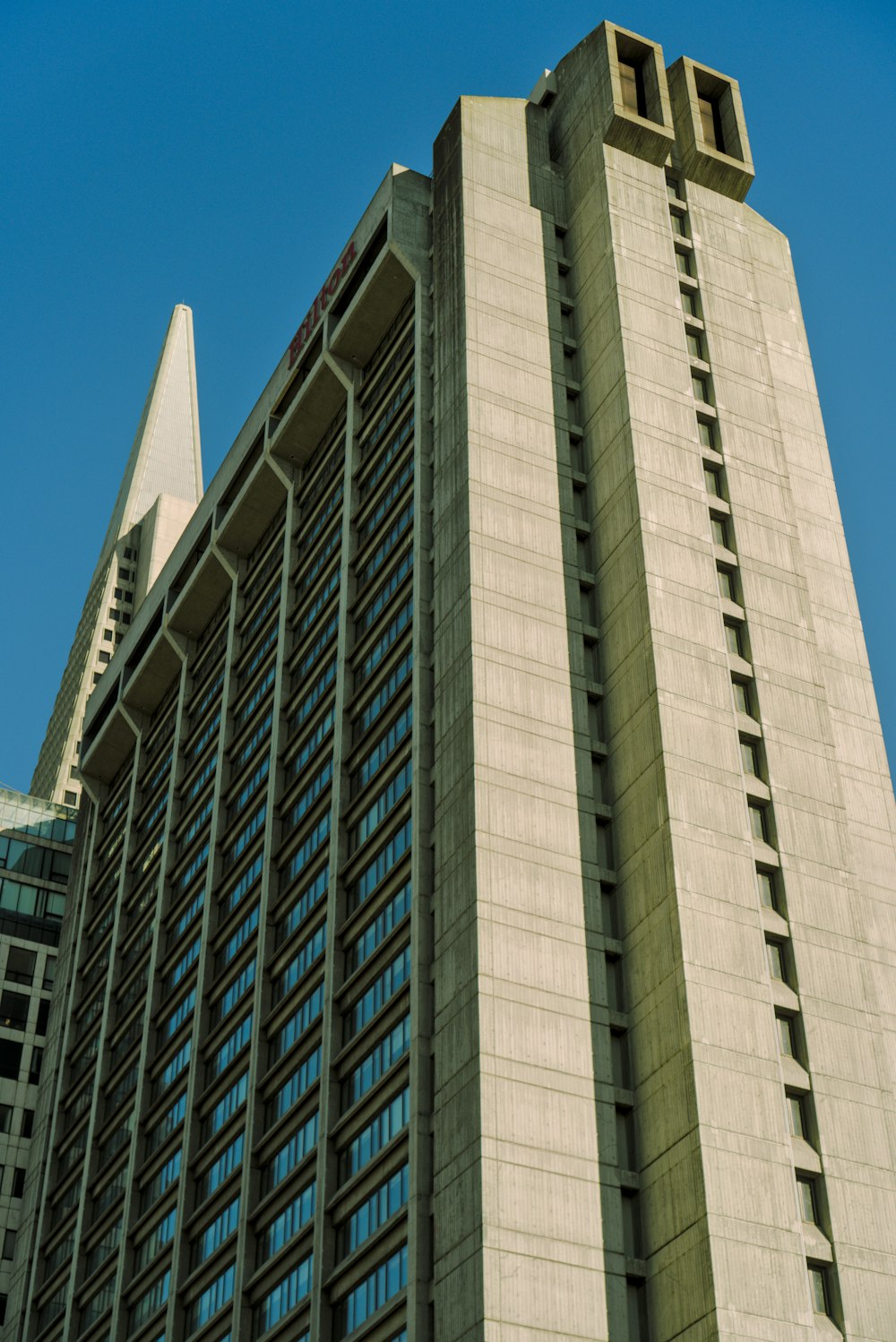 a very tall building with a clock on it's side