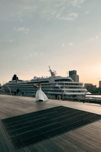 Travel consultant assisting a happy couple planning their premium cruise journey.