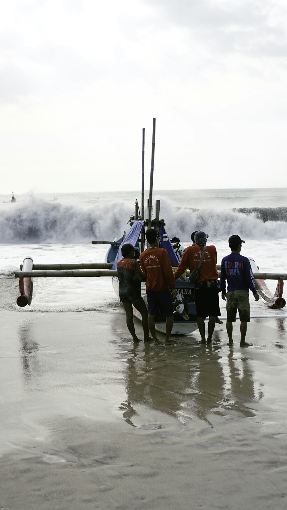 a group of people standing in front of a boat