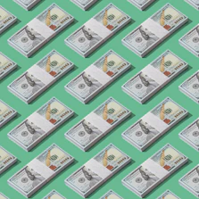 a lot of money sitting on top of a green surface