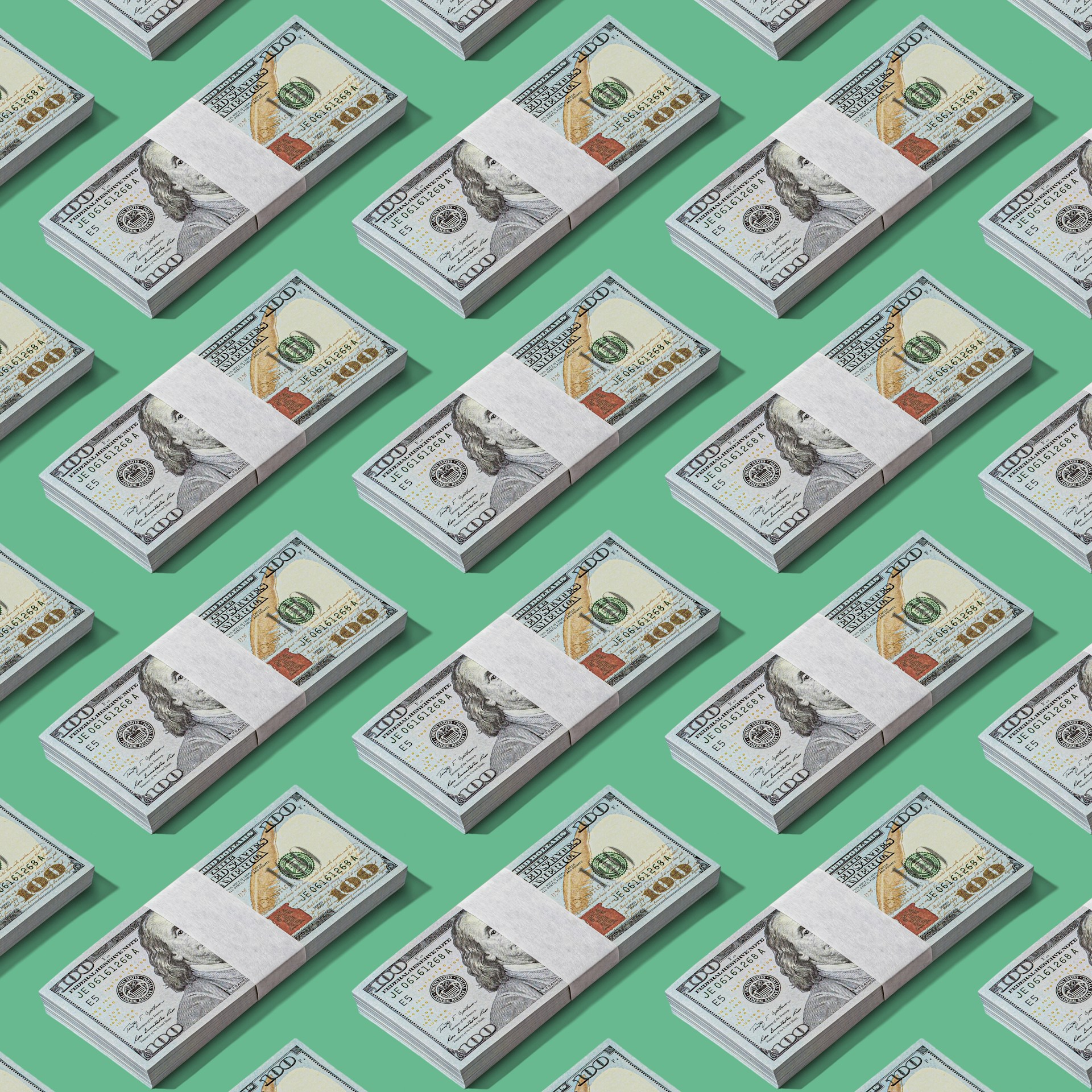 a lot of money sitting on top of a green surface