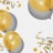 Several shiny golden balloons float alongside curling ribbons and scattered confetti on a light background, casting soft shadows.