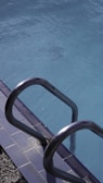A beautiful swimming pool with clear blue water.