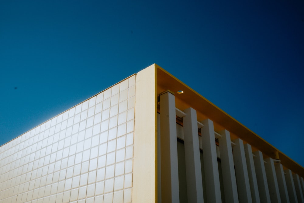 a white building with a blue sky in the background