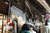 A vibrant marketplace with various construction materials displayed.