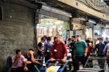 A local market bustling with shopkeepers and customers.