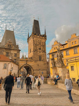 A group of tourists exploring a famous European landmark on a guided city tour.