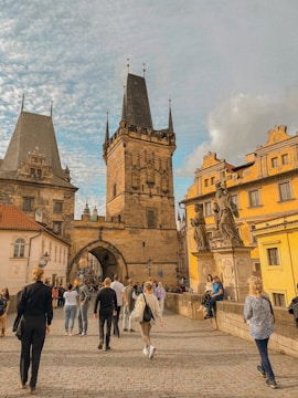 Students engaged in a guided historical city tour, taking notes and observing landmarks.