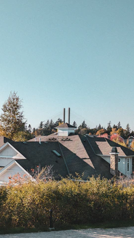 Wide shot of a residential home with a newly repaired chimney stack.