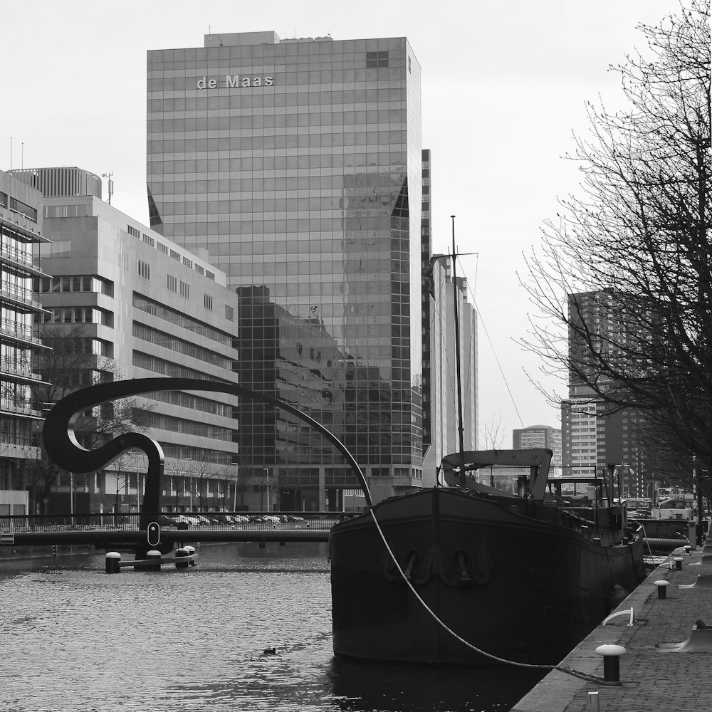 a black and white photo of a boat in the water