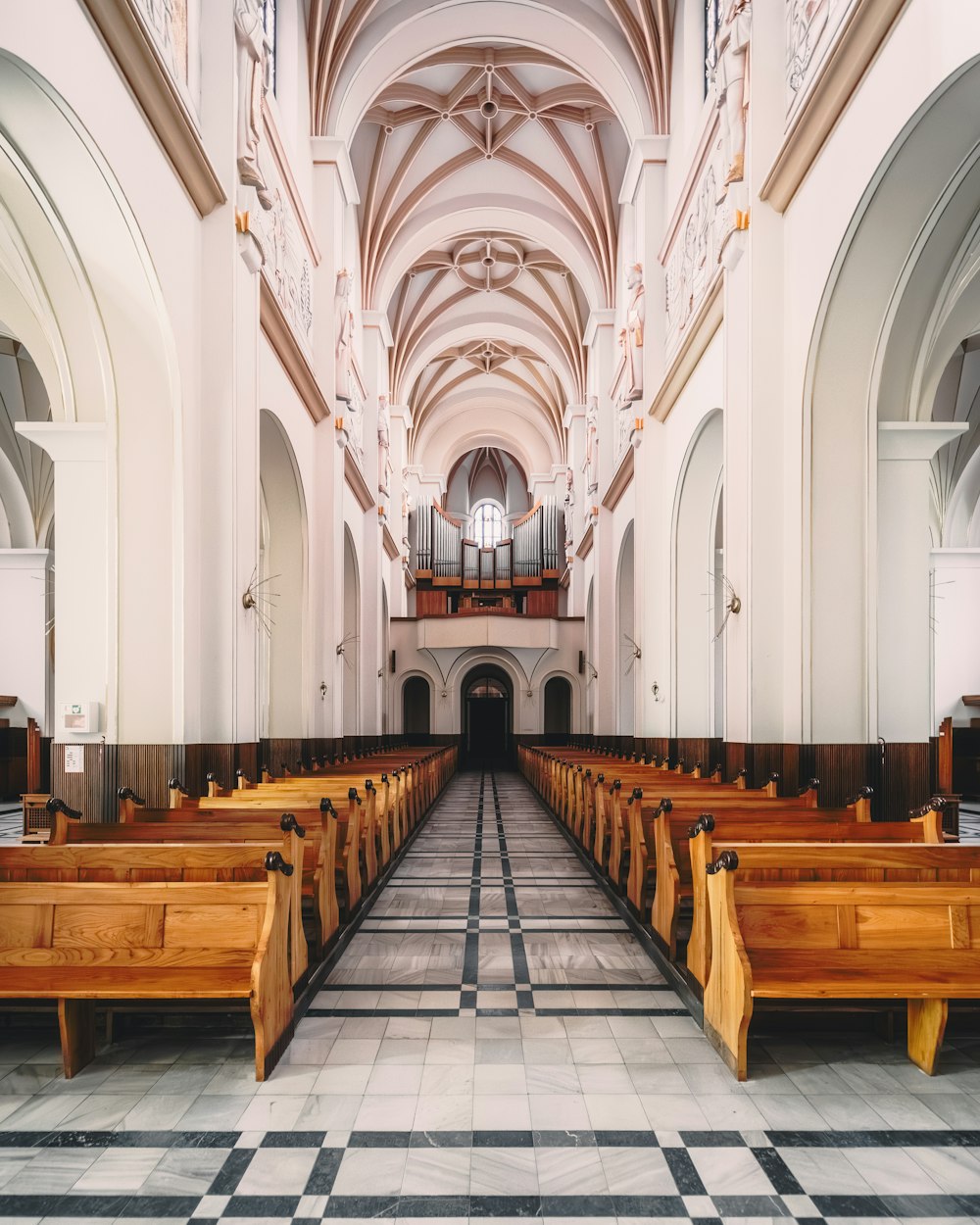 a church with pews and a checkered floor