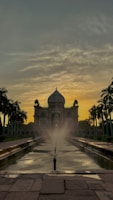 Sunset over an iconic Indian monument with warm, glowing skies.