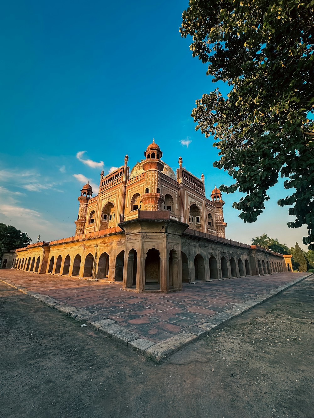 a large building sitting on top of a cement field