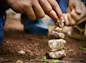 a person stacking rocks on top of each other